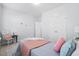 Bright bedroom with carpet, featuring a bed with pillows and a blanket at 3707 Blackjack Rd, Ladson, SC 29456
