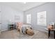 Light-filled bedroom featuring two windows, carpet, and light-blue walls at 3707 Blackjack Rd, Ladson, SC 29456