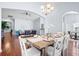 Open dining room with wood floors, vaulted ceiling, and an elegant chandelier for Gathering gatherings at 3707 Blackjack Rd, Ladson, SC 29456