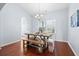 Dining room with hardwood floors, chandelier and a large table with seating for six, great for entertaining at 3707 Blackjack Rd, Ladson, SC 29456