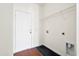 Laundry room with white door, hardwood floors, and hookups for a washer and dryer at 3707 Blackjack Rd, Ladson, SC 29456
