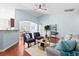 Inviting living room with hardwood floors, stylish seating, and a view of the kitchen and dining area at 3707 Blackjack Rd, Ladson, SC 29456