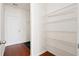 Pantry with wired shelving and hardwood floors leading to a white exterior door at 3707 Blackjack Rd, Ladson, SC 29456