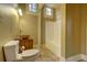 Bathroom with a tub/shower combo and a wood vanity with a stone sink, with tile flooring at 408 N Parler Ave, Saint George, SC 29477