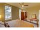 Bedroom showcasing a bed, an antique side table, a window and a doorway with natural light at 408 N Parler Ave, Saint George, SC 29477