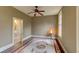 Bedroom with wood floors and an ensuite bathroom, with muted neutral tones and inviting natural light at 408 N Parler Ave, Saint George, SC 29477