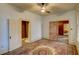 Bedroom showcasing wood flooring, with a decorative area rug, two doorways and natural light at 408 N Parler Ave, Saint George, SC 29477