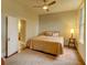 Bedroom showcasing a bed, a side table, natural light from the window and an attached bathroom at 408 N Parler Ave, Saint George, SC 29477