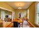 Elegant dining room with hardwood floors, natural light, and ample space for hosting gatherings at 408 N Parler Ave, Saint George, SC 29477