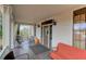 Comfortable front porch with seating area, railing and natural lighting provides a peaceful place to unwind at 408 N Parler Ave, Saint George, SC 29477