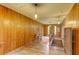 Spacious hallway with wood paneled walls and hardwood floors, offering a glimpse into the home's architectural details at 408 N Parler Ave, Saint George, SC 29477