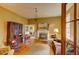 Cozy living room featuring a fireplace, hardwood floors, natural light, and comfortable seating at 408 N Parler Ave, Saint George, SC 29477