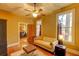 Comfortable living room with hardwood floors, tan walls and views to other rooms at 408 N Parler Ave, Saint George, SC 29477