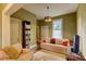 Comfortable living room features hardwood floors, a cozy couch, and neutral walls and trim at 408 N Parler Ave, Saint George, SC 29477