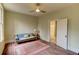 Living Room featuring an old sofa, wooden flooring, a doorway, a lamp on a table and natural light at 408 N Parler Ave, Saint George, SC 29477