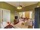 Spacious living room with hardwood floors, couch, and light entering from an adjacent dining room at 408 N Parler Ave, Saint George, SC 29477