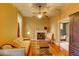 Comfortable living room with fireplace, hardwood floors, and tan walls with views to bathroom at 408 N Parler Ave, Saint George, SC 29477