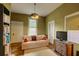 Comfortable living room features hardwood floors, a cozy couch, and neutral walls and trim at 408 N Parler Ave, Saint George, SC 29477