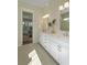 This bathroom features double sinks, access to shower, and entry to bedroom at 4217 Royal Harbor Rd, Hollywood, SC 29449