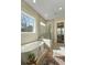 This primary bathroom features a large tub and walk-in glass shower at 4217 Royal Harbor Rd, Hollywood, SC 29449