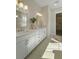 Modern bathroom with double vanity, elegant mirrors, and lots of light at 4217 Royal Harbor Rd, Hollywood, SC 29449
