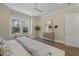 Bright bedroom features a hardwood floor, ceiling fan, and window seat at 4217 Royal Harbor Rd, Hollywood, SC 29449