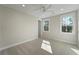 Well-lit bedroom with neutral carpet and two windows offering great views at 4217 Royal Harbor Rd, Hollywood, SC 29449