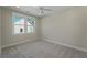 Bright, carpeted bedroom with a ceiling fan and natural light at 4217 Royal Harbor Rd, Hollywood, SC 29449