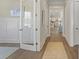 Bright foyer with hardwood floors, decorative rugs, and views through to the open concept kitchen at 4217 Royal Harbor Rd, Hollywood, SC 29449