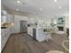 Modern kitchen features a large center island, stainless steel appliances, and open layout at 4217 Royal Harbor Rd, Hollywood, SC 29449
