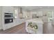 Gourmet kitchen with white cabinetry, stainless steel appliances, and a large island perfect for entertaining at 4217 Royal Harbor Rd, Hollywood, SC 29449