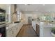 Spacious kitchen with stainless steel appliances, white cabinets, an island and ample counter space at 4217 Royal Harbor Rd, Hollywood, SC 29449