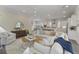 Bright, open-concept living room with modern furnishings and decor flowing into the kitchen at 4217 Royal Harbor Rd, Hollywood, SC 29449