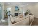 Comfortable living room featuring a brick fireplace, large sofa, lots of natural light and modern decor at 4217 Royal Harbor Rd, Hollywood, SC 29449