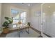 Bright and functional home office featuring a modern desk, hardwood floors, and natural lighting at 4217 Royal Harbor Rd, Hollywood, SC 29449