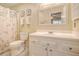 Clean bathroom with a white vanity, seashell-themed shower curtain, and neutral tones at 433 Double Eagle Trace, Seabrook Island, SC 29455
