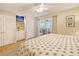 Bright bedroom with a TV, closet space, and access to an outdoor seating area at 433 Double Eagle Trace, Seabrook Island, SC 29455