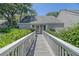 Charming exterior view of the home with gray siding and well-manicured landscaping at 433 Double Eagle Trace, Seabrook Island, SC 29455