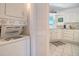 Convenient laundry area with a stacked washer and dryer located near the kitchen at 433 Double Eagle Trace, Seabrook Island, SC 29455