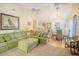Spacious living room with high ceilings, comfortable seating, and a dining area with natural light at 433 Double Eagle Trace, Seabrook Island, SC 29455