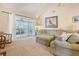 Spacious living room with sliding doors leading to a screened porch, perfect for relaxing and entertaining at 433 Double Eagle Trace, Seabrook Island, SC 29455