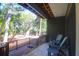 Cozy back porch with comfortable chairs, wood floors, and nature views for relaxing and enjoying outdoor space at 4901 Green Dolphin Way, Kiawah Island, SC 29455