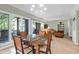 Open concept dining room boasts large windows and an adjacent living room at 4901 Green Dolphin Way, Kiawah Island, SC 29455