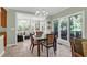 Bright dining room with a glass-top table and views of the lush surroundings at 4901 Green Dolphin Way, Kiawah Island, SC 29455