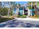 Stylish condo with teal siding, sidewalks, palm trees, and convenient parking at 4901 Green Dolphin Way, Kiawah Island, SC 29455