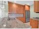 Well-lit kitchen boasting custom cabinets, granite countertops, and stainless steel appliances at 4901 Green Dolphin Way, Kiawah Island, SC 29455