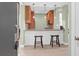 Modern kitchen features pendant lighting, bar seating, and light wood cabinetry at 4901 Green Dolphin Way, Kiawah Island, SC 29455