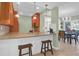 Kitchen featuring a breakfast bar with seating and an open design to the dining area at 4901 Green Dolphin Way, Kiawah Island, SC 29455