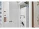 A dedicated laundry closet features a stacked washer and dryer at 4901 Green Dolphin Way, Kiawah Island, SC 29455