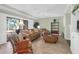 Inviting living room featuring tile floors, comfortable seating, and seamless outdoor access at 4901 Green Dolphin Way, Kiawah Island, SC 29455